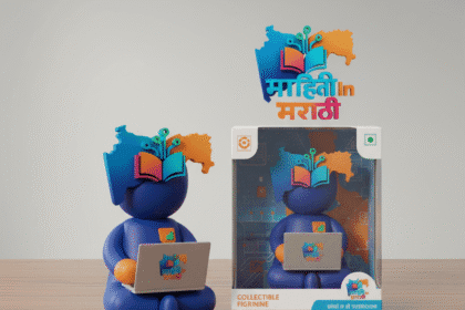 Nano Banana AI वापरून फोटो ते 3D Figurine बनवा 4 3D collectible figurine holding a laptop with Mahiti In Marathi logo and branded packaging box on wooden desk